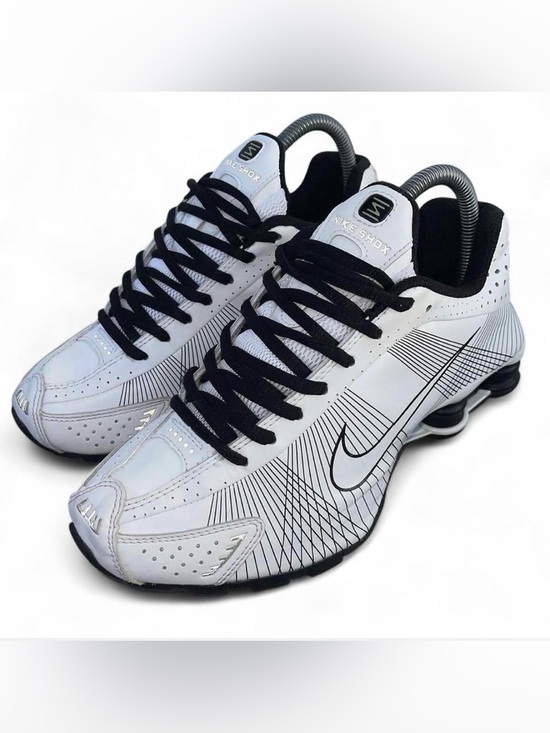 Nike Other - Nike Shox R4 sneakers in a white colorway with black accents.